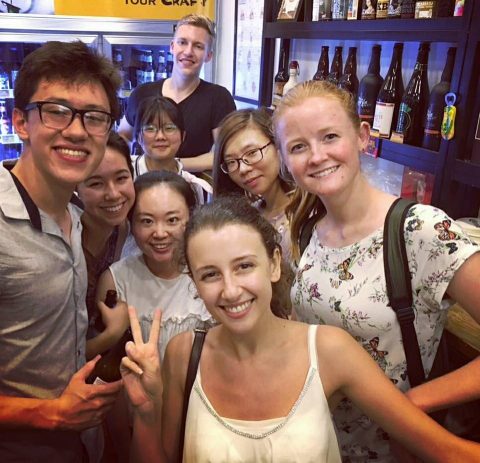 Maggie with her friends and classmates at a bar in Shanghai