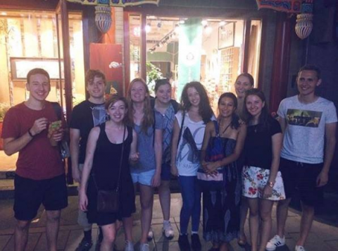 Student group photo outside a restaurant in Beijing
